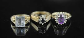 Lot 41: Three 14k gold rings, some set with diamonds