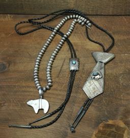 Lot 59: Two Native American silver bolo ties with a necklace, signed