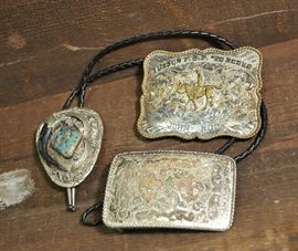 Lot 64: Two sterling silver belt buckles and one bolo tie