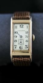 Lot 69: 14k rose gold Longines wrist watch, leather band