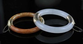 Lot 74: Two 14k gold jade bracelets