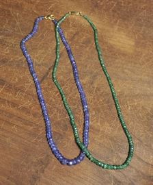 Lot 75: Emerald and amethyst bead necklaces, two pieces with gold clasps