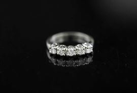 Lot 77: 14k white gold and diamond band, approx. 1ctw