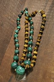 Lot 78: One malachite and one tigers eye necklaces , 14k clasps