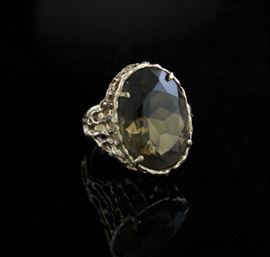 Lot 86: 14k ladies topaz ring