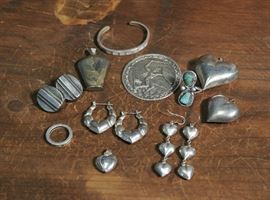Lot 100: Sterling silver medal, one cuff, three pairs of earrings, two rings, three pendants and one mini vase/bottle (87 and 105)