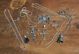 Lot 119: Two sterling silver pendants with chains along with two s/s chains, crosses, amulet and an ankh (36 & 44)