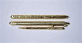 Lot 125: Three gold Cartier pens, two 14k felt tip pens and one 14k mechanical pencil