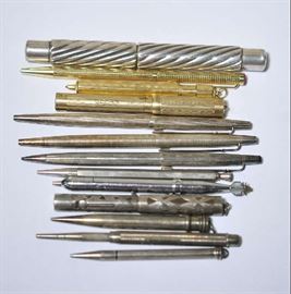Lot 129: Assorted vintage sterling and gold pen lot, incl. sterling Caran d'Ache pen, sterling cut-out fountain pen and many others