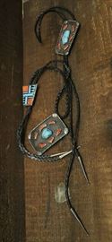 Lot 132: Two bolo ties and one belt buckle, South Western style