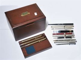 Lot 136: Five Cross pens in original wood case with other assorted pens