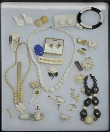 Lot 142: Large bone lot containing: necklace, earrings, cuff links, bracelet, ring