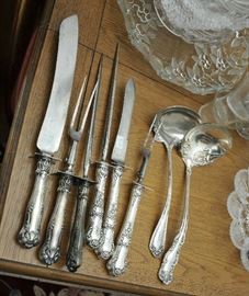 Two, three piece silver handled carving sets with ladles