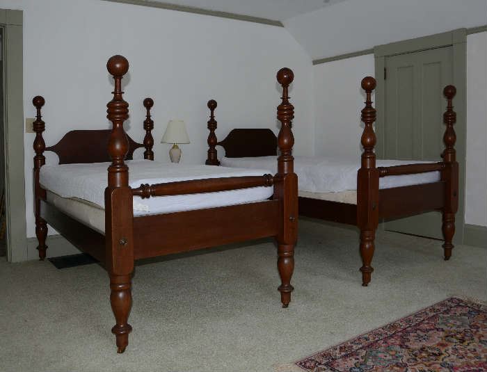 Pair of cannonball beds with bedding