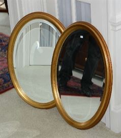 Pair of decorative oval wall mirrors