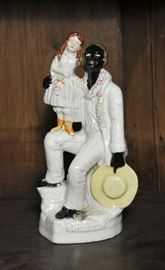 Staffordshire figural group, black man with child - 10"H