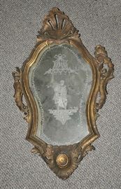 Early carved and gilt European wall mirror with a unique etched mirrored glass 