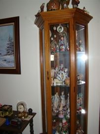 curio cabinet with collectibles