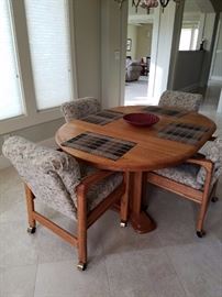 Round Table with 1 Leaf and 6 Roller Chairs