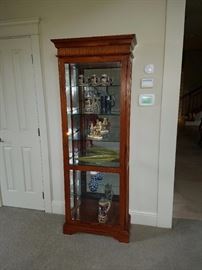 Two Curio Cabinets with Glass Backs and Glass Shelves. 