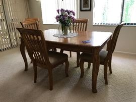 Nice oak dining room table with six chairs and matching server 63 x 42