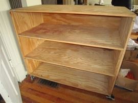 One of three deep shelved storage bins on wheels.30