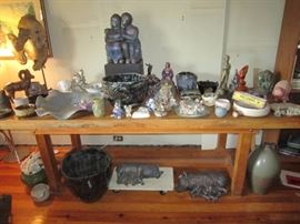 Vintage butcher table from a grocery store loaded with ceramic pieces
