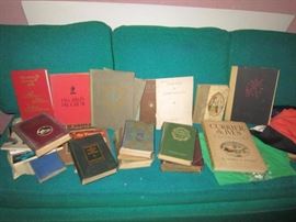 Vintage books on a vintage sleeper sofa-the back fold down like a futon.  Great color!