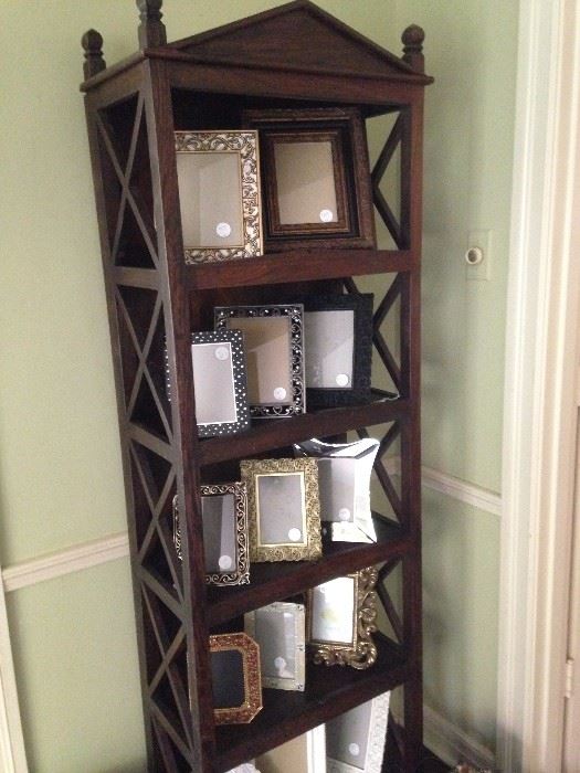 Five-tiered display cabinet filled with stunning frames