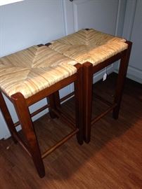 Two of four rush seat bar stools
