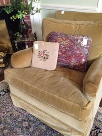 One of two matching fireside chairs; decorative pillows