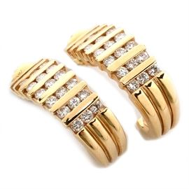 14K Yellow Gold Diamond Pierced Earrings: A pair of 14K yellow gold diamond pierced earrings.