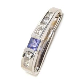 18K White Gold Diamond and Tanzanite Pendant: An 18K white gold diamond and tanzanite pendant.