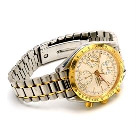 Men's Omega Speedmaster 18K Gold and Steel Automatic Wristwatch: A men’s Omega Speedmaster 18K yellow gold and stainless steel automatic wristwatch. Includes box and papers with operating instructions.