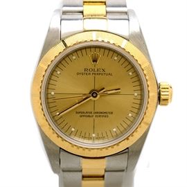 Women's Rolex Perpetual 18K Gold and Steel Champagne Automatic: A women’s Rolex Perpetual 18K yellow gold and stainless steel champagne automatic wristwatch.