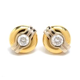 18K Two Tone Gold Diamond Pierced Earrings: A pair of 18K two tone diamond pierced earrings with 0.24 ctw in round brilliant cut diamonds.