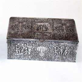 Vintage Derby Silver Plate Co. Repousse Trinket Box: A vintage silver plate repousse trinket box from Derby Silver Plate Co. The box features scenes of children at play and decorative scrolls and flowers in high relief on the top and sides. The hinged box opens to a wood-lined compartment for storing your treasures. It is marked with #3502 and the maker’s name to underside.