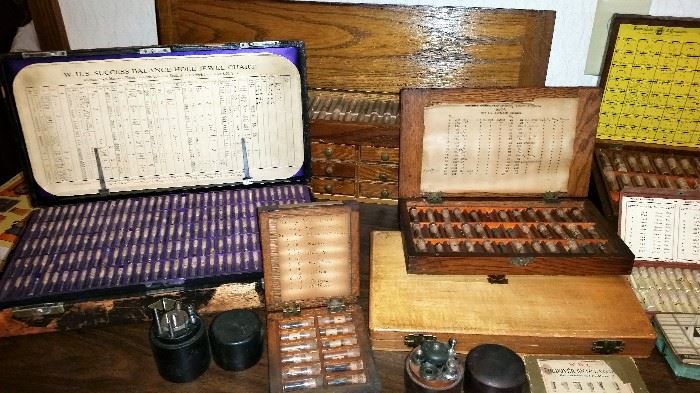 Antique watchmaker tools in boxes