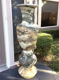 Polished marble pair of vases on the front entry (67”Tx20”W).. WOW.