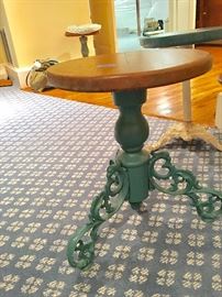 One of two matching cast iron Victorian piano/garden stools