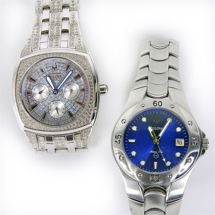 Men's Bulova Swarovski And Diving Wristwatches: A pair of men’s Bulova Swarovski and diving wristwatches. The watches include a stainless steel crystal chronograph watch embellished with 412 Swarovski crystals, featuring date, day and dual time subdials and water resistance to 30 meters (model 96C002); and a Marine Star stainless steel blue men’s diver watch, water resistant up to 100 meters (model C860521). Both watches include extra links.