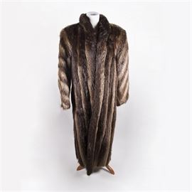 Miller Brothers Full Length Brown Fur Coat with Hat: A Miller Brothers full length brown fur coat with a hat. The coat features two tone striped brown fur. The hat is a black pillbox style with brown fur encircling the rim.