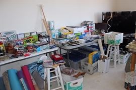 Flat screen TV, new unopened stationary and office supplies, storage cubes, stools, crafting supplies.