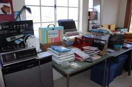Small under the counter fridge, office supplies, new HP printer, desk accessories, clock radios.