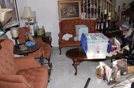 Matching arm chairs and loveseat, matching end and coffee tables. Four matching table and floor lamps.