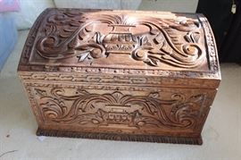 Hand carved wooden storage trunk.