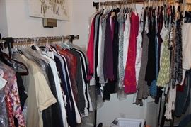 three racks of brand new Cabi clothing.