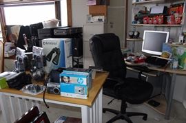 Binoculars, cameras, clocks, radios, computer desk, chair, NEW IN BOX DELL laptop,, speakers, ink cartridges, photo paper, filing cabinet, pine prep table.