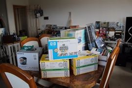 Sony clock radio, HP photo printer, New In Box Dell laptop, kitchen table and chairs.