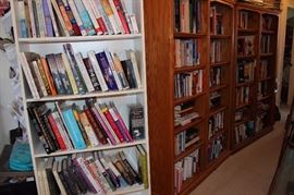 Bookcases full of hard and paperback books.
